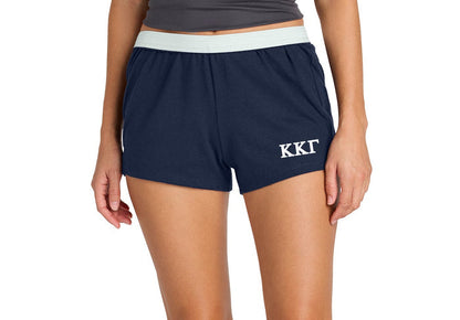 Navy shorts with 'Kappa Kappa Gamma' logo worn by a person on a white background